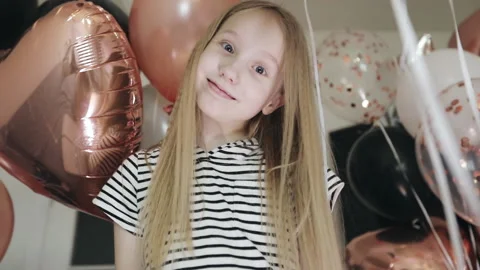 Blonde girl is having fun on the background of balloons. Stock Footage 143735407
