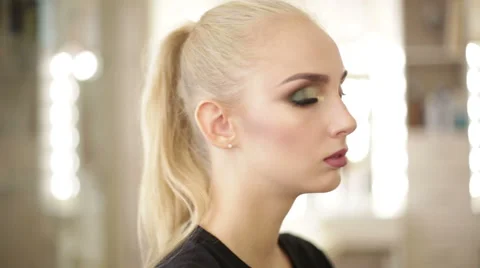 Blonde girl looking at the camera Stock-Footage 68013986