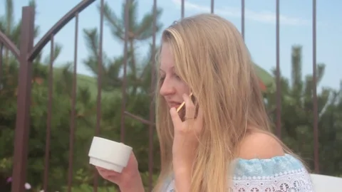 Blonde girl talking on the phone Stock-Footage 80811253