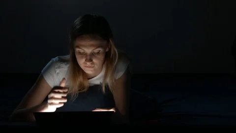 Blonde girl using digital tablet Isolated Black. Video stock 89050090