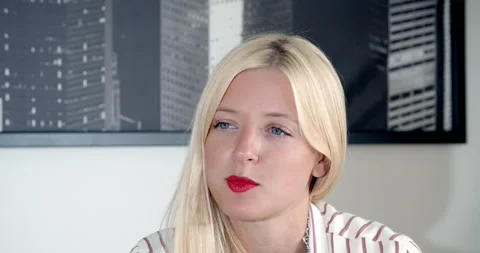 Blonde gives an interview in the office Stock Footage 139572463