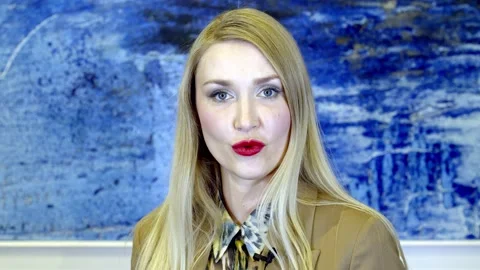 Blonde gives an interview in the studio Video stock 148753534
