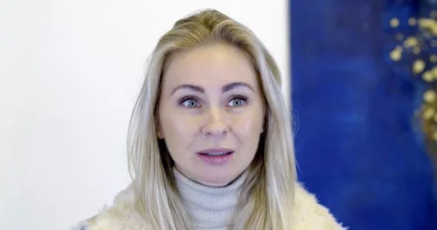 Blonde gives an interview in the studio Video stock 148930816