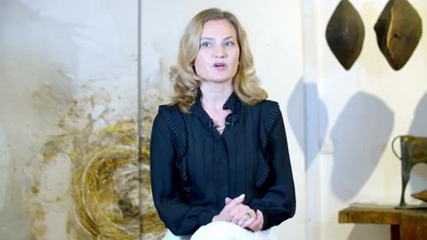 Blonde gives an interview in the studio Stock Footage 148943315