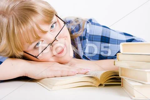 Blonde in glasses with books Stock Photos