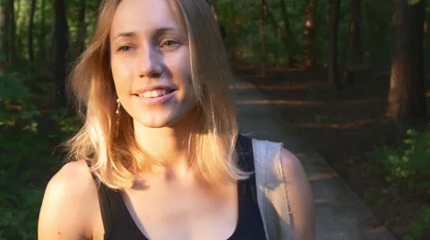 Blonde goes through the forest Stock Footage 66564787