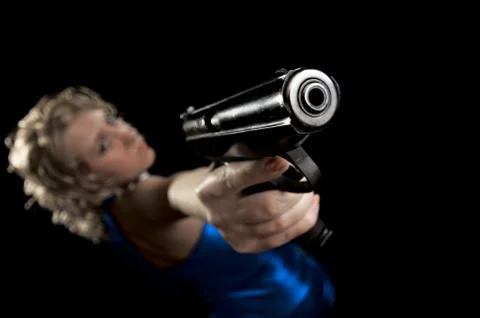 Blonde with gun Stock Photos
