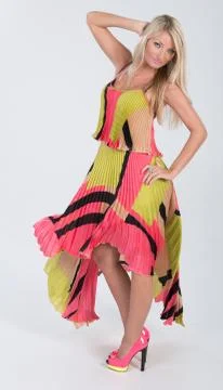 Blonde haired model in multi colored dress Stock Photos