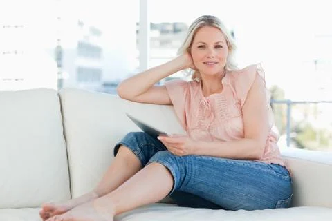 Blonde holding a touchpad Fotos Stock
