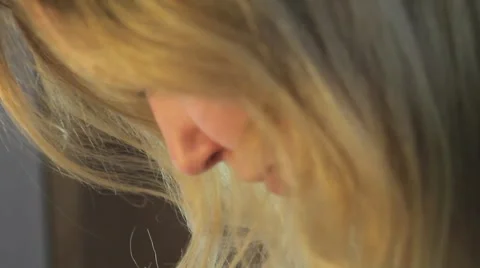 Blonde Lady Looking Down Stock Footage 1184610