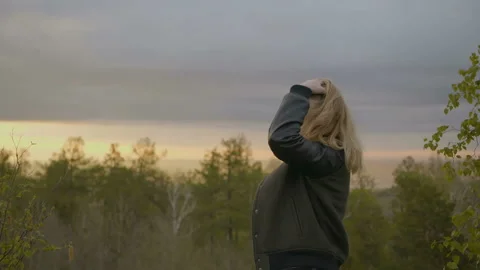 Blonde is looking at camera Stock Footage 91189571