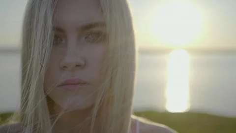 Blonde is looking at camera Stock Footage 92158783