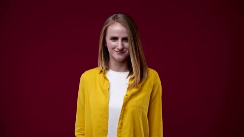 Blonde looks at the camera and winks Stock Footage 163880699
