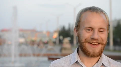 Blonde man with a beard emotionally looking at the camera Stock-Footage 64885616