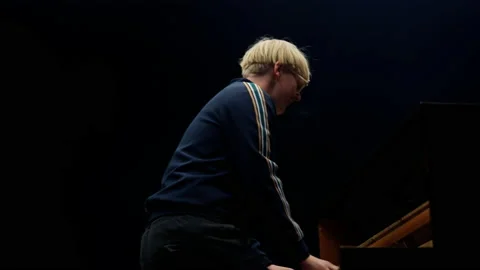 Blonde Man In Blue Jacket Playing The Piano 스톡 동영상 236512794