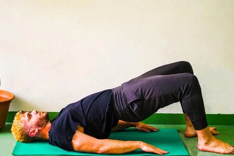 Blonde man stretching Stock Photos