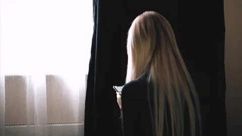 Blonde is messging with the iphone x Stock Footage 99700827