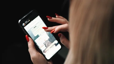 Blonde is messging with the iphone x Stock Footage 99701079