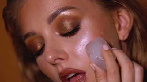 Blonde model with bright evening makeup. Beauty, fashion. Girl posing in studio Stock Footage 141085472