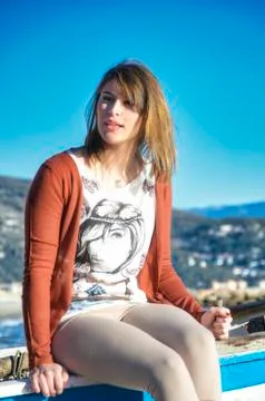 Blonde model dressed in red in a seductive pose 库存照片