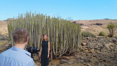 Blonde Model in Front of Cacti Posing for the Camera 스톡 동영상 112023281