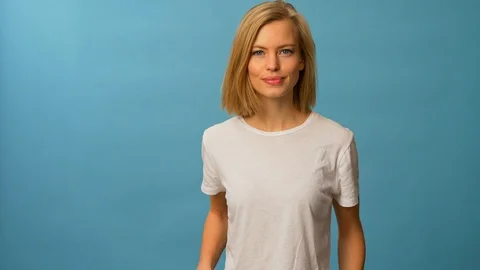 Blonde model watching something on her phone 스톡 동영상 103625689