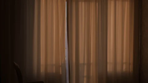 Blonde opens the curtains 스톡 동영상 106344985