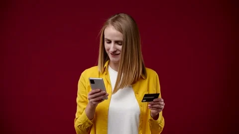 Blonde overwrites the data from the card to the phone Stock Footage 163880997