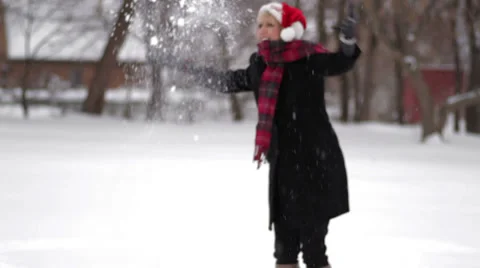 Blonde playing in the snow Stock Footage 33624138