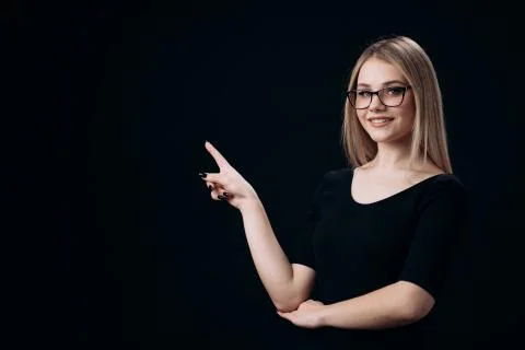Blonde pointing on empty space with finger Stock Photos