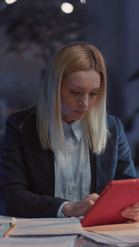 Blonde pretty young woman using tablet notepad application and browsing internet Video stock 313793414