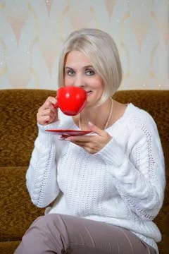 Blonde with a red cup Stock Photos