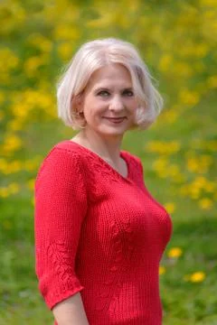 Blonde in a red pullover Foto stock