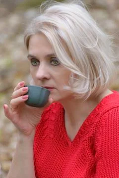 Blonde in a red pullover Stock Photos