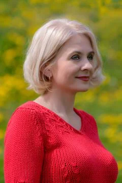 Blonde in a red pullover Stock Photos