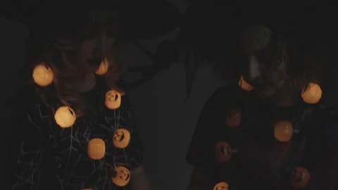 Blonde &amp; Redhead Witches Looking Down At Black &amp; White Skulls Stock Footage 226475275