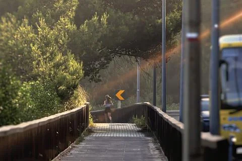 A blonde running on a deck Foto stock