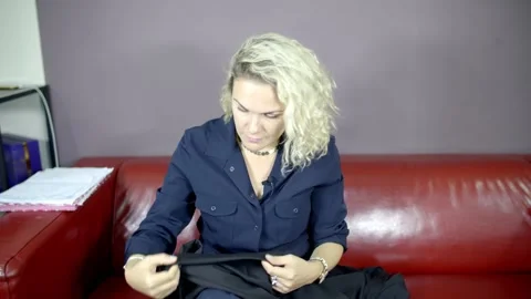 Blonde sews with a needle Stock Footage 142158706