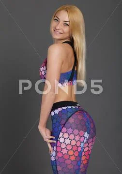 Blonde sexy woman posing in sport clothes Stock Photos