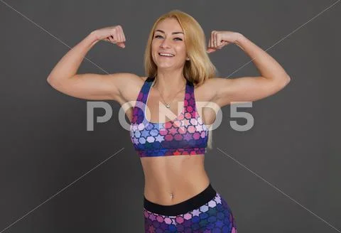 Blonde sexy woman posing in sport clothes Stock Photos