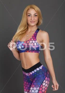 Blonde sexy woman posing in sport clothes Stock Photos