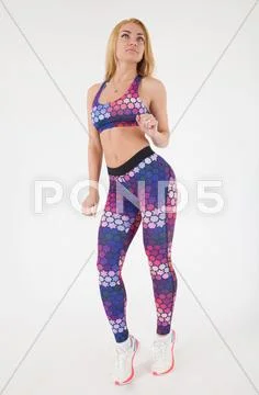 Blonde sexy woman posing in sport clothes Stock Photos