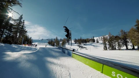 Blonde skier does crazy rail trick blue sky extreme action Видео 103823182