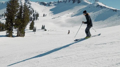 Blonde skier does crazy trick off jump in sunny mountains extreme action Видео 103822799