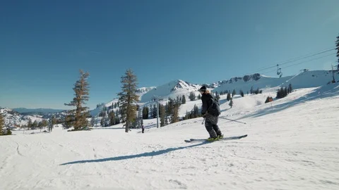 Blonde skier does crazy trick off jump in sunny mountains extreme action Видео 103823323