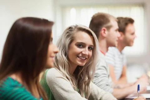 Blonde smiling student looking at camera Fotos Stock