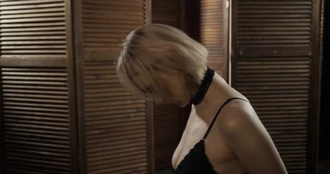 blonde-submissive-woman-slave-kneeling-footage-115332894_iconl.jpeg