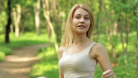 The blonde turns and winks. Stock Footage 75818529