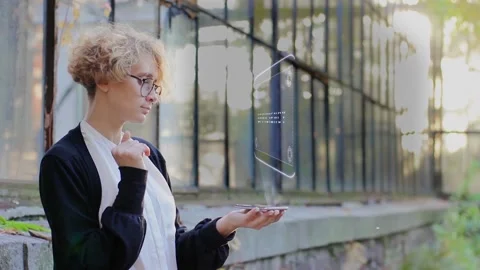Blonde uses hologram Efficiency Stock Footage 158294156