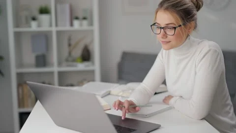 Blonde using laptop for distance learning Stock Footage 143981718